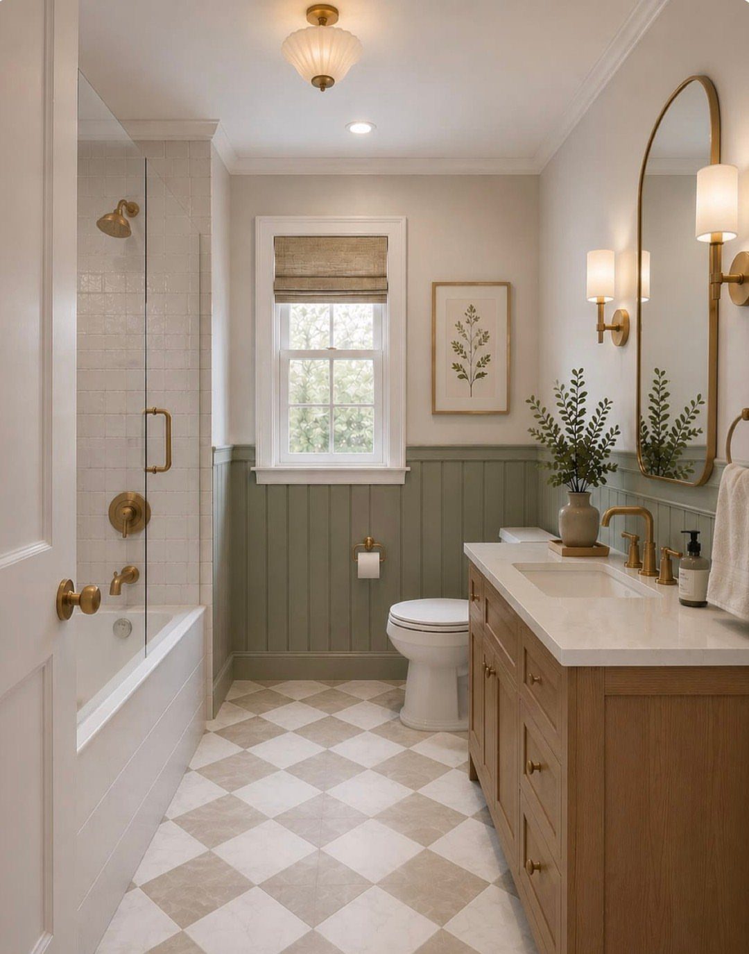 Light wood bathroom vanity with white sink and sage green wainscoting walls.