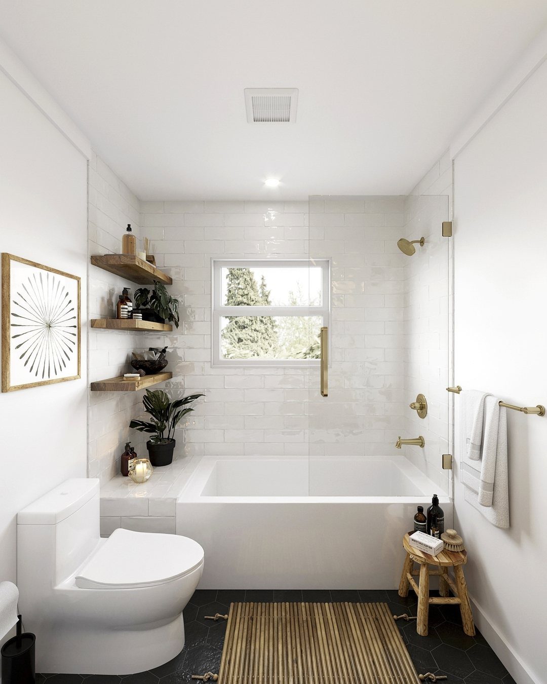 White bathtub with gold fixtures in a bright bathroom with subway tile walls.
