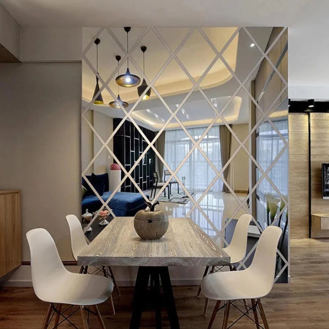 Diamond-shaped mirror tiles on a wall reflecting a modern living and dining room