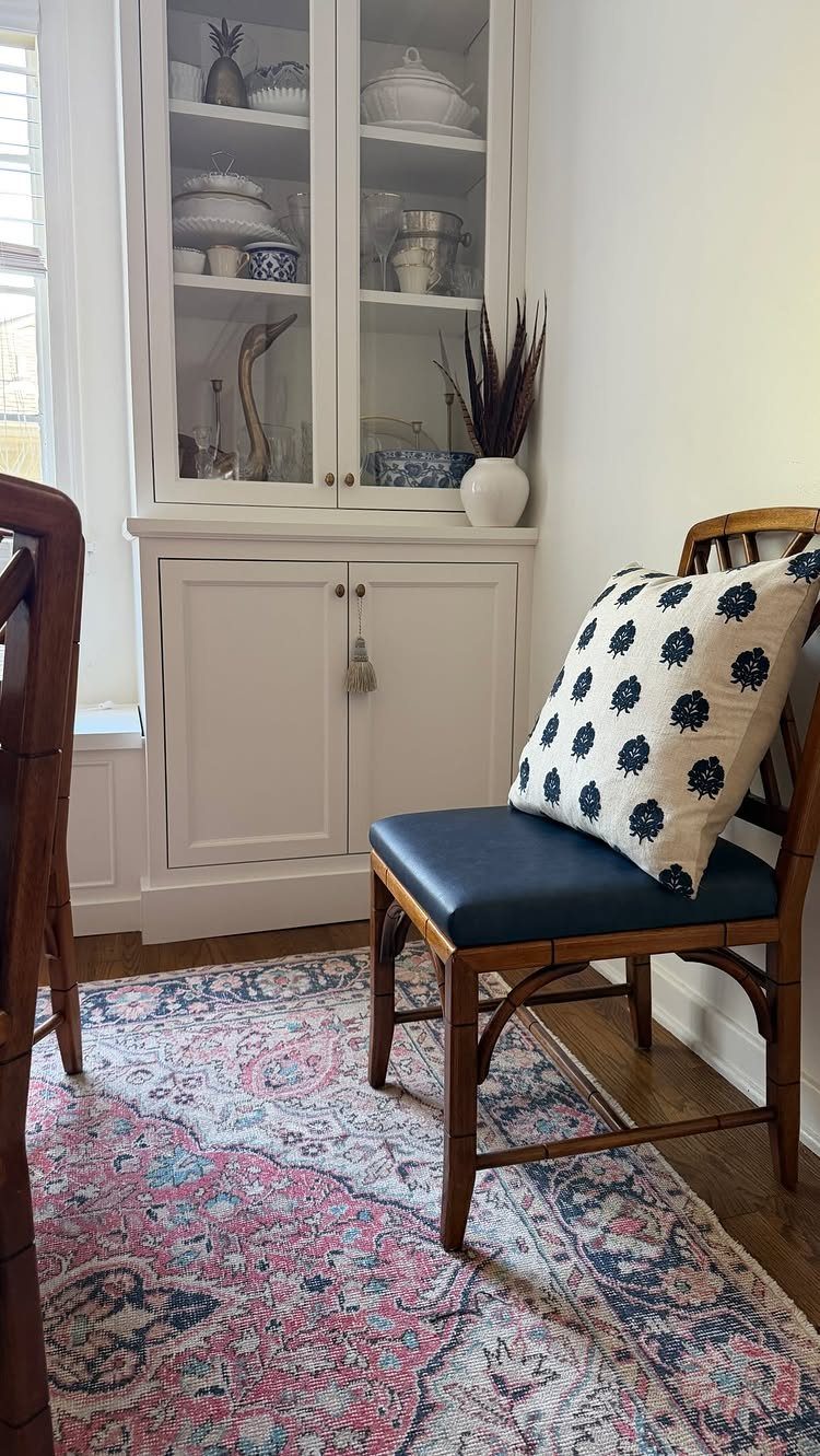 Dining Room Side Cabinet Designs with 18 Stylish Options 7 White built-in dining cabinet with glass doors and a patterned rug below.