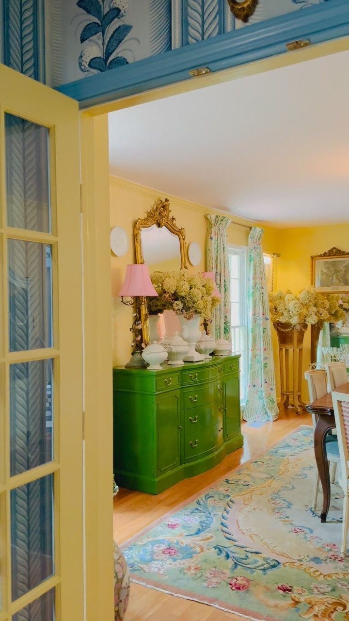 Dining Room Side Cabinet Designs with 18 Stylish Options 3 Green curved sideboard with white vases and pink lamps under a gold mirror.