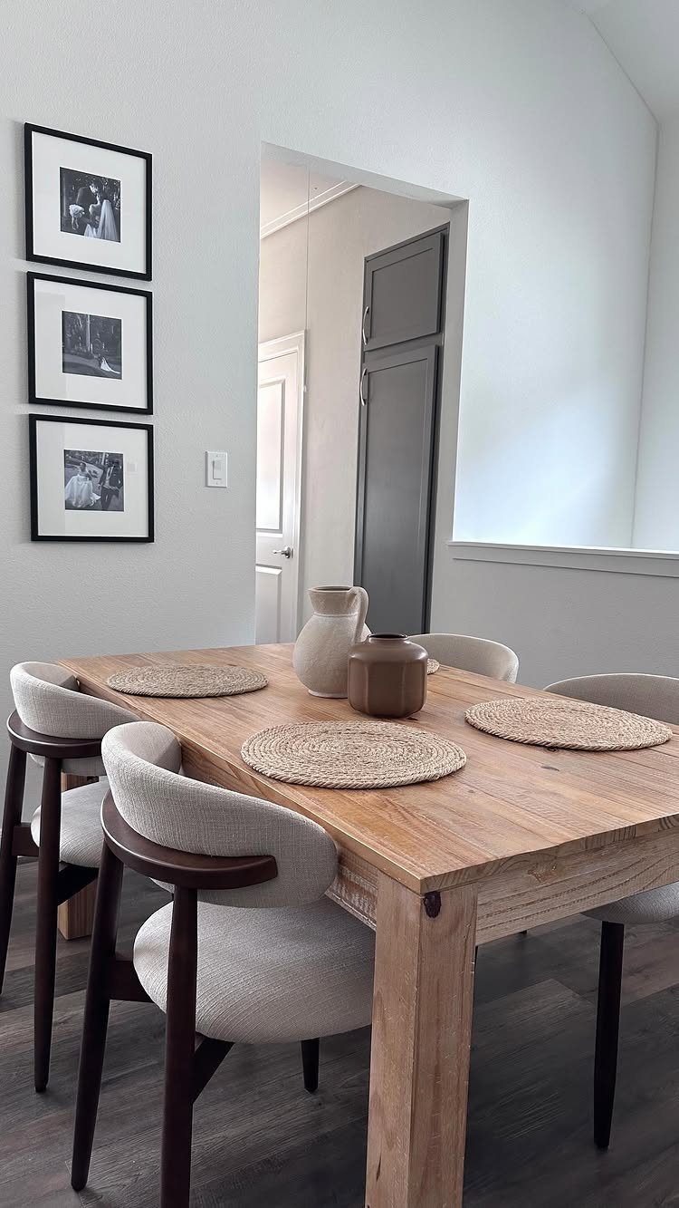Fabric Chairs Dining Ideas: 32 Styles, Colors, and Frames 12 Beige upholstered dining armchairs with dark brown frames around a light wood table.