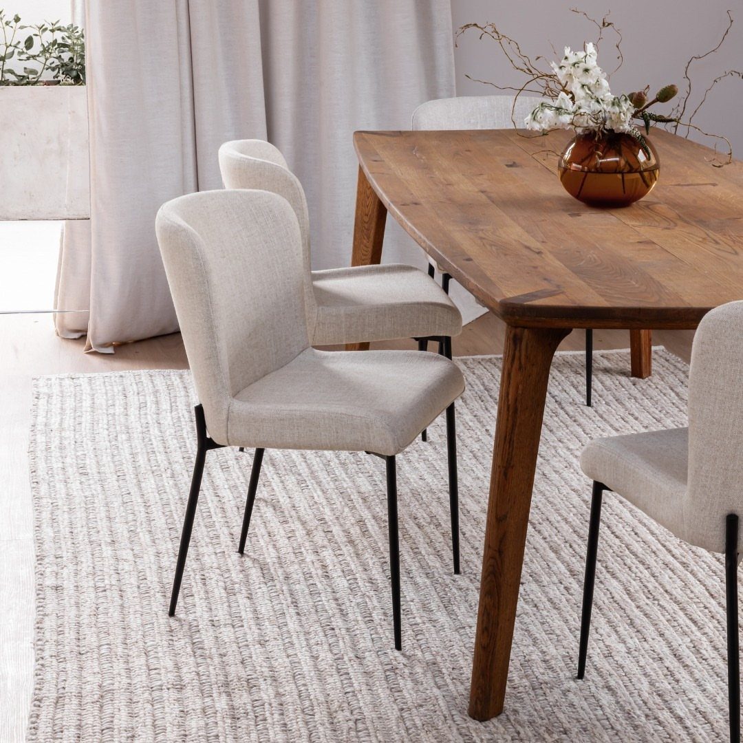 Fabric Chairs Dining Ideas: 32 Styles, Colors, and Frames 20 Beige fabric dining chairs with black metal legs around a wooden table