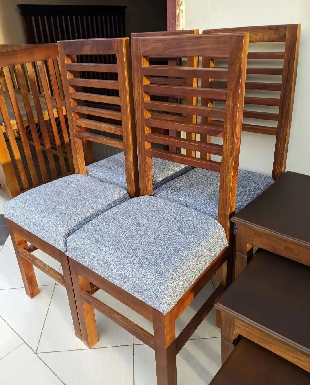 Fabric Chairs Dining Ideas: 32 Styles, Colors, and Frames 30 Wooden dining chairs with horizontal slat backs and grey fabric upholstered seats.