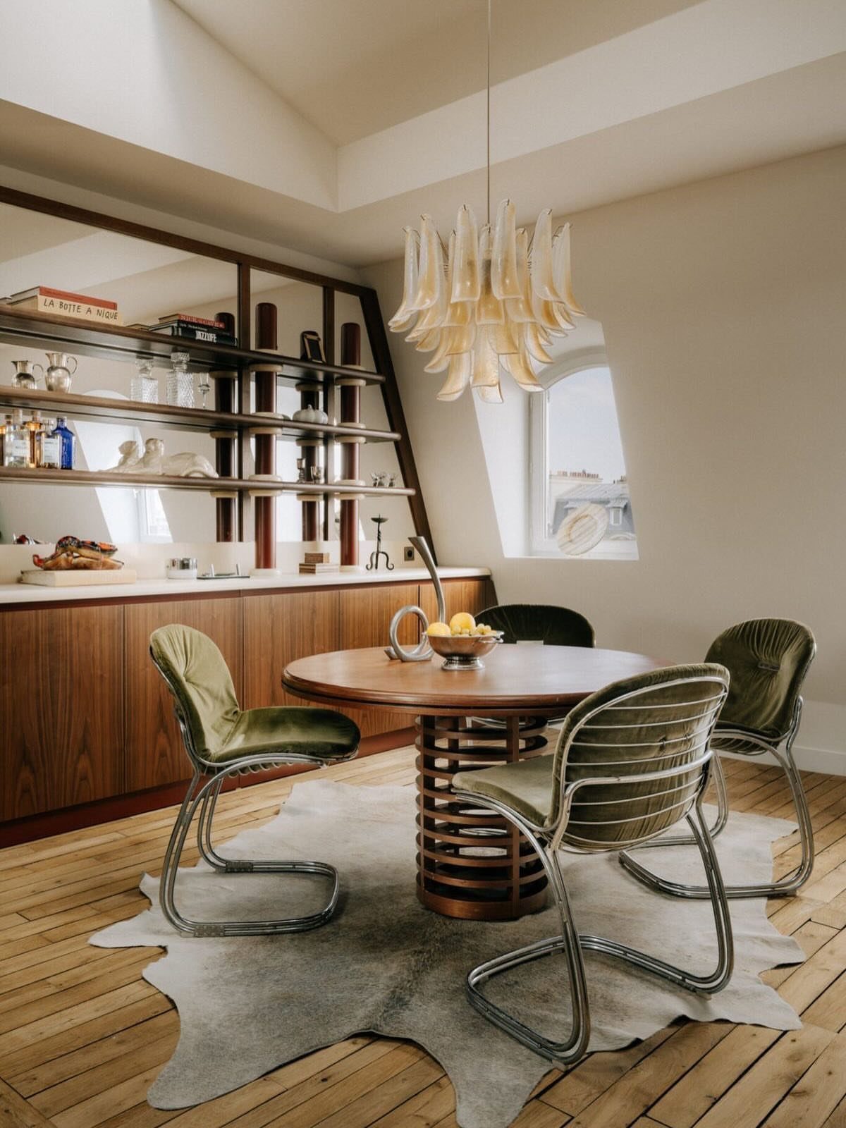 Fabric Chairs Dining Ideas: 32 Styles, Colors, and Frames 22 Green upholstered dining chairs with chrome frames around a round wooden table.