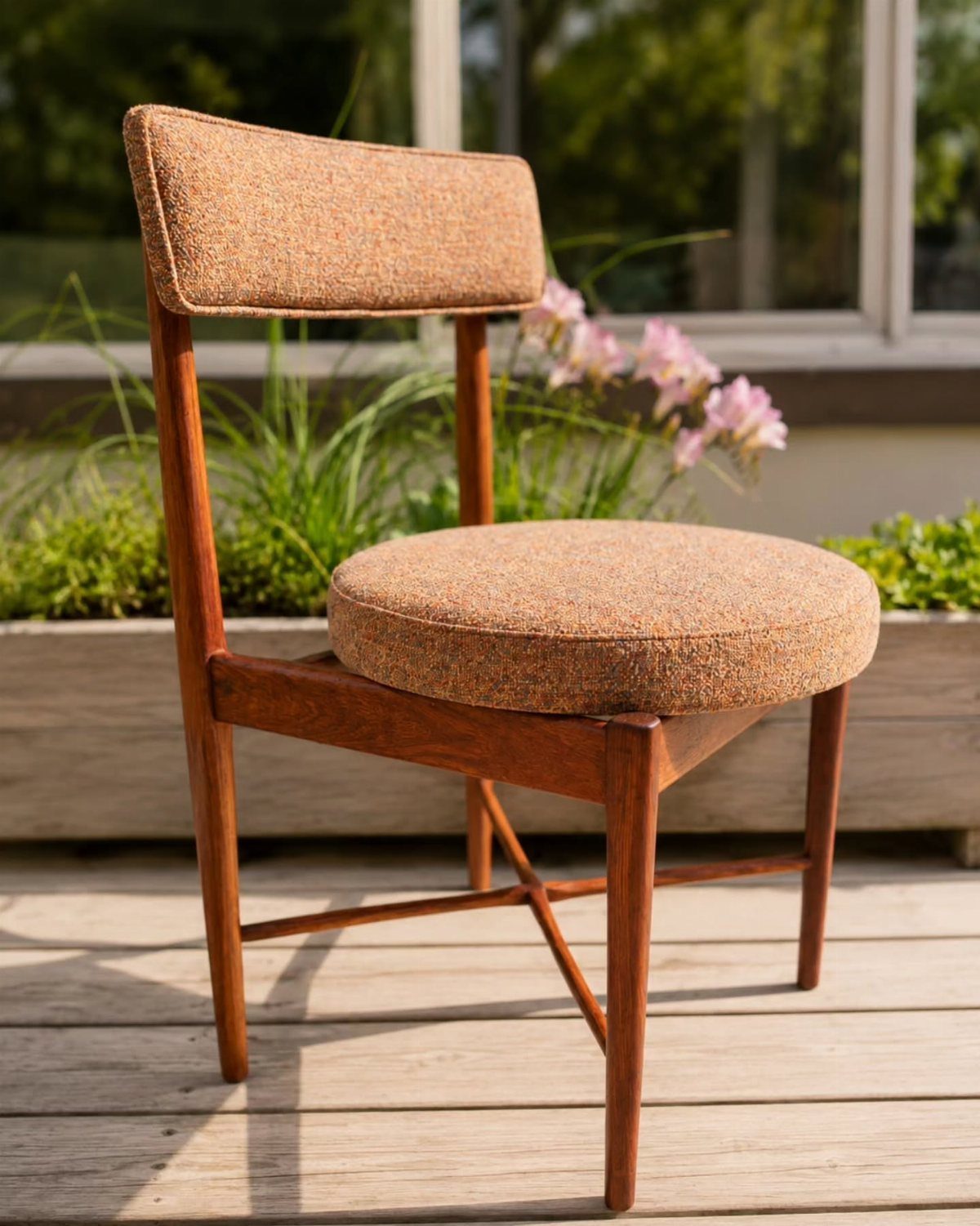 Fabric Chairs Dining Ideas: 32 Styles, Colors, and Frames 4 Brown fabric dining chair with tapered wooden legs on a sunny outdoor deck.
