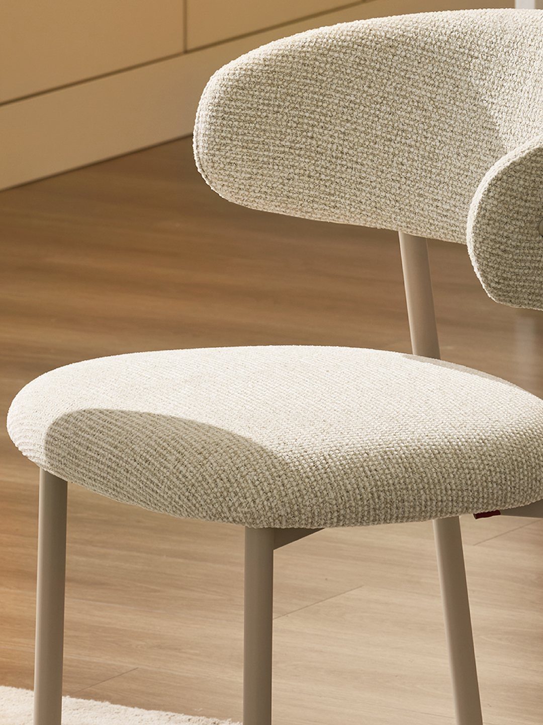 Fabric Chairs Dining Ideas: 32 Styles, Colors, and Frames 3 Modern dining chair with light beige textured fabric upholstery and slim grey metal legs.