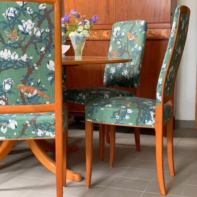 Fabric Chairs Dining Ideas: 32 Styles, Colors, and Frames 7 Green floral upholstered dining chairs with wooden frames around a wooden table.