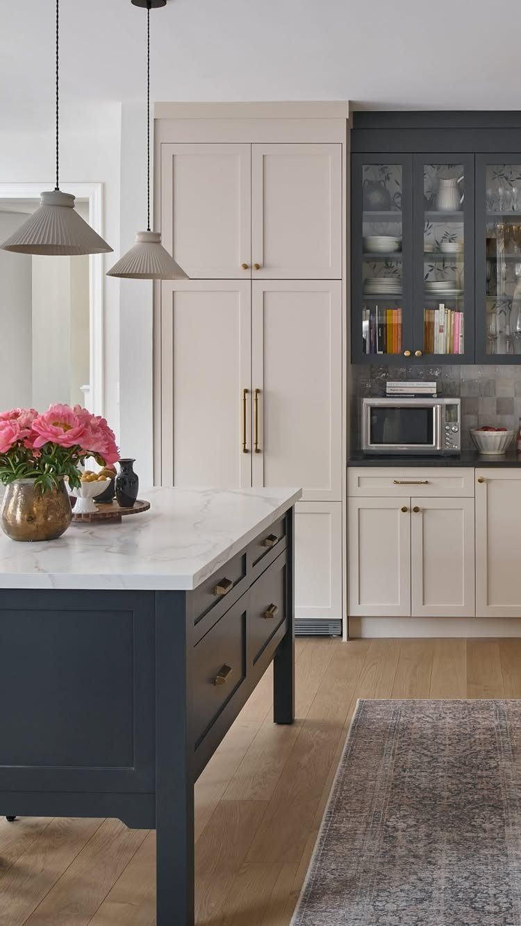 35 Farmhouse Kitchen Remodel Ideas Worth Stealing 31 Cream-colored refrigerator panels blending into custom cabinetry in a farmhouse kitchen setting.