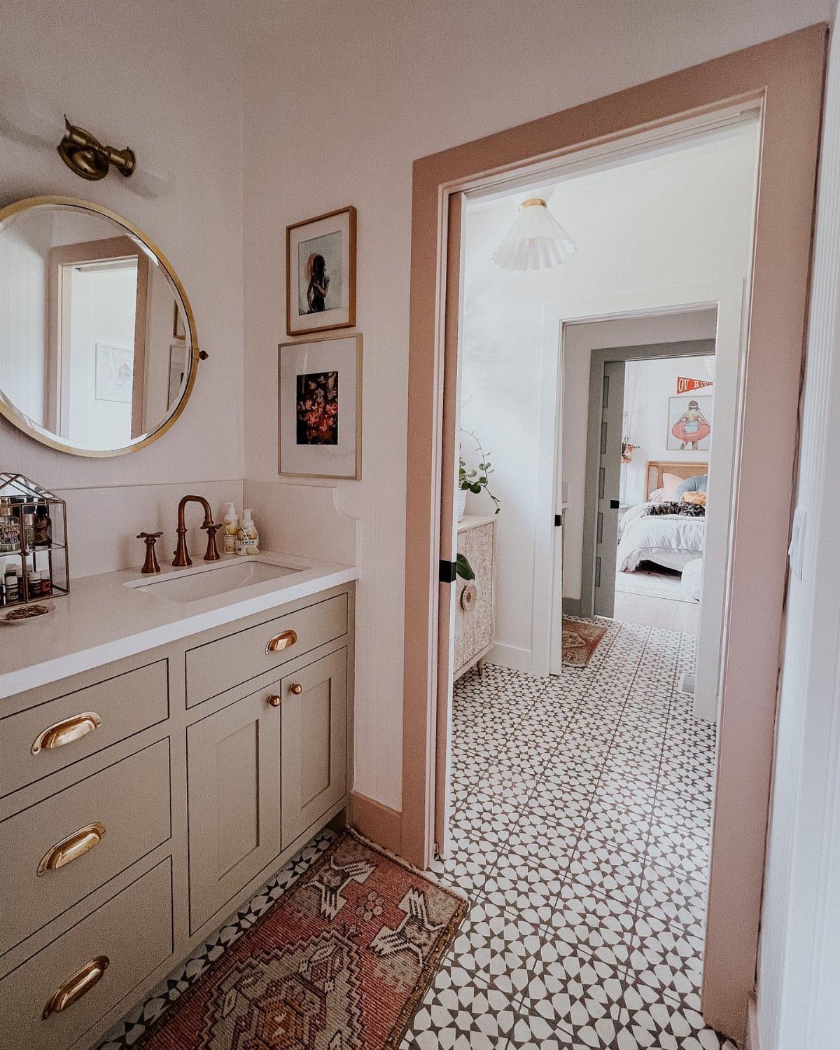 17 Jack and Jill Bathroom Remodel Ideas for Shared Spaces 15 Beige bathroom vanity and patterned tile floor leading to a bedroom doorway.