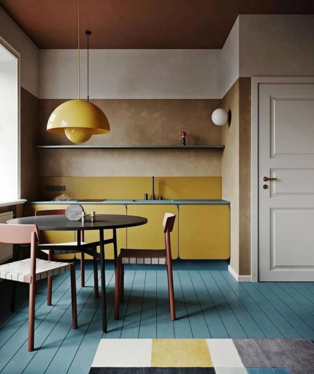 28 Kitchen Cabinets Remodel Ideas and Photos to Try in 2026 25 Color-blocked kitchen with yellow cabinets, blue flooring, and a dark reddish-brown ceiling.