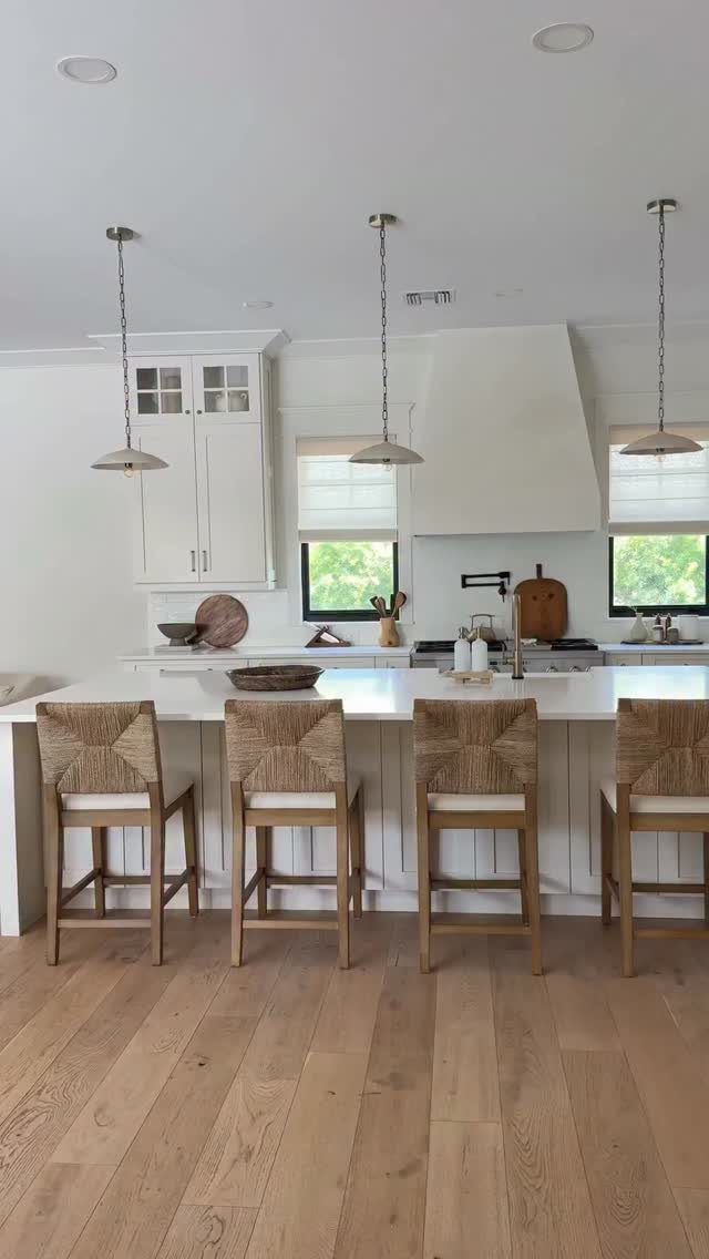 28 Kitchen Cabinets Remodel Ideas and Photos to Try in 2026 21 Four woven wooden bar stools lined up at a white kitchen island.