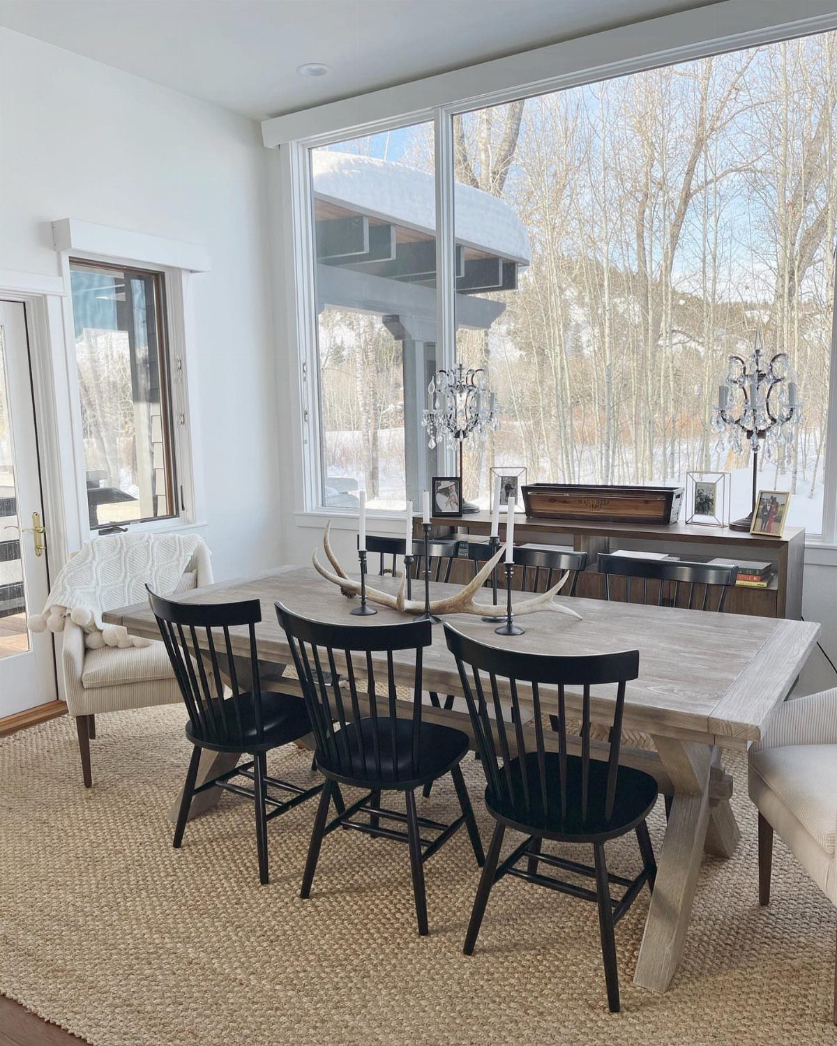 Mismatched Chairs Dining Table: 12 Ideas for a Cohesive Look 4 Light wood dining table with black side chairs and contrasting upholstered end chairs.