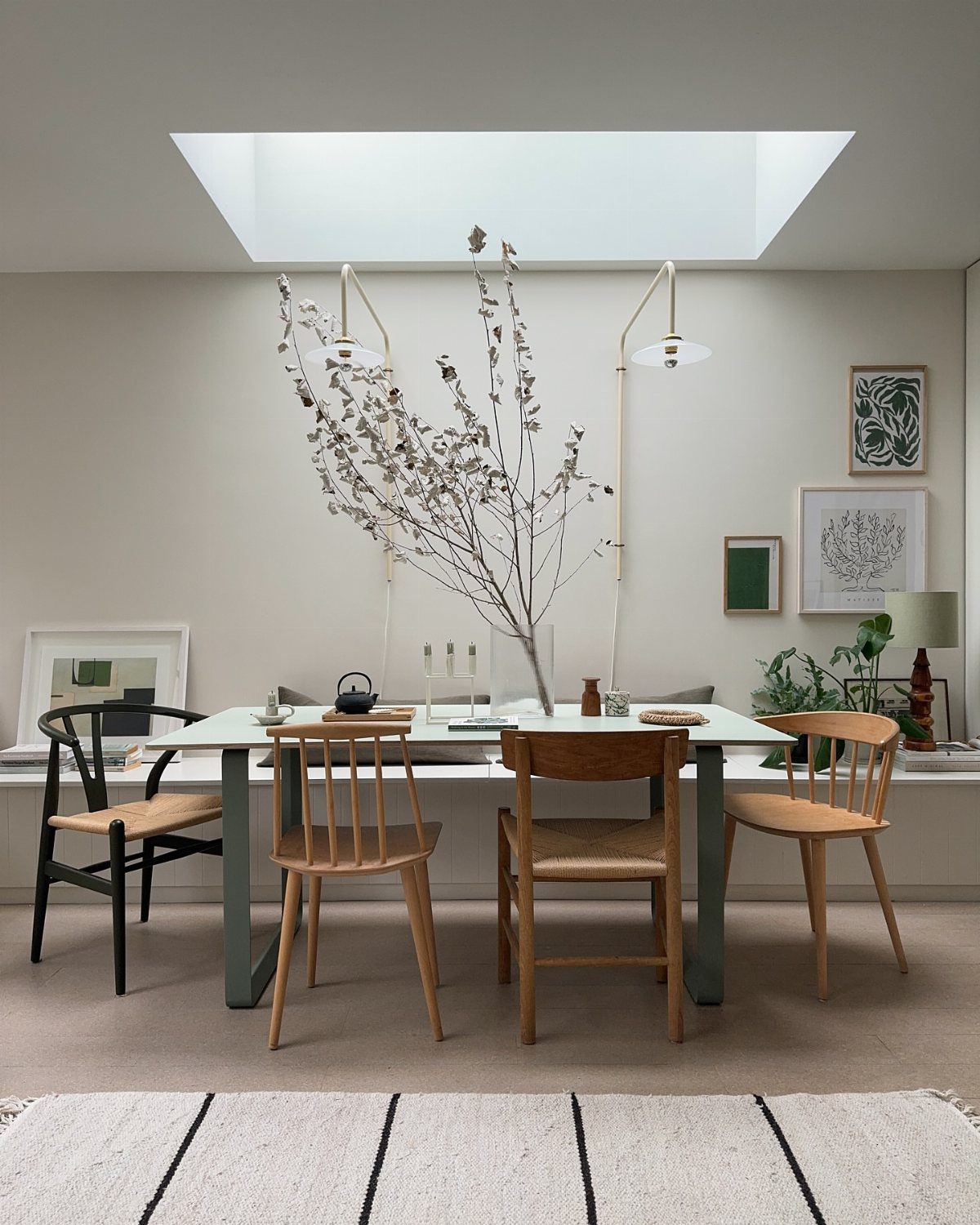 Mismatched Chairs Dining Table: 12 Ideas for a Cohesive Look 5 Mismatched wooden dining chairs with woven seats around a light-colored rectangular table.