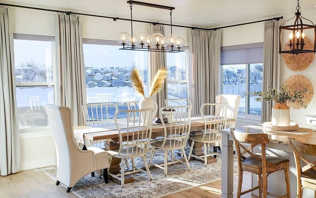 Mismatched Chairs Dining Table: 12 Ideas for a Cohesive Look 1 Wooden dining table with mismatched white chairs in a bright, modern dining room.