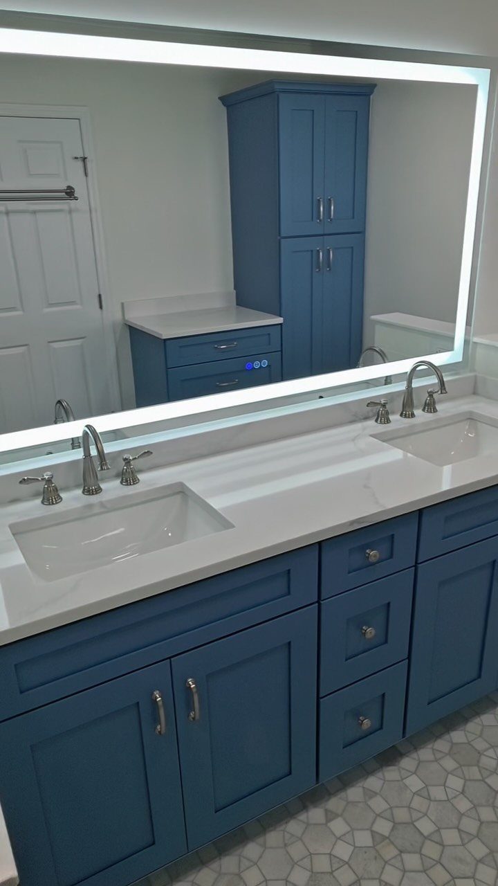 12 Mobile Home Master Bath Remodel Ideas and Moisture Tips 11 Double vanity with blue cabinets, white countertop, and a large backlit mirror.