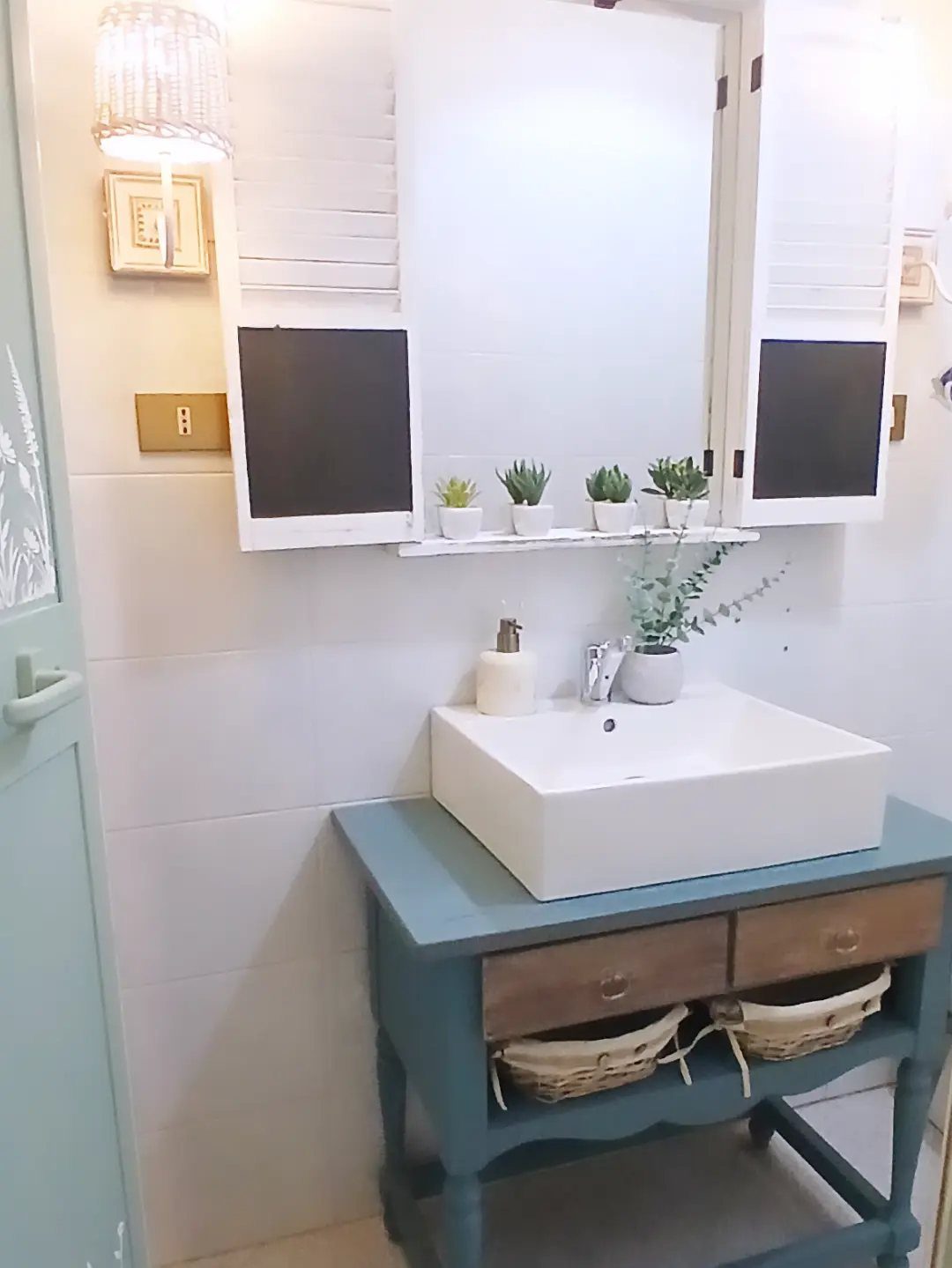 12 Mobile Home Master Bath Remodel Ideas and Moisture Tips 4 Teal painted bathroom vanity with white vessel sink and mirrored shutters