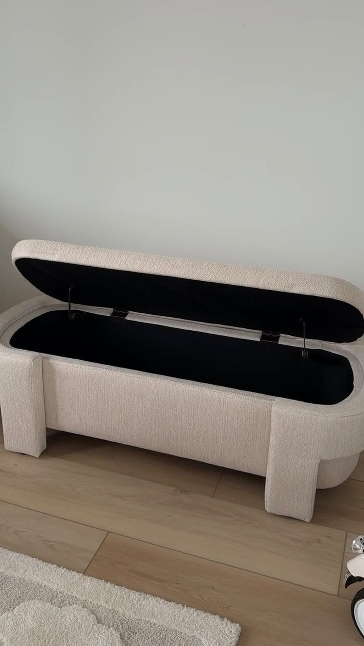 17 Remodeling Old House Ideas for Kitchens, Baths, Offices 2 Beige fabric storage ottoman with open lid on a light wood floor.