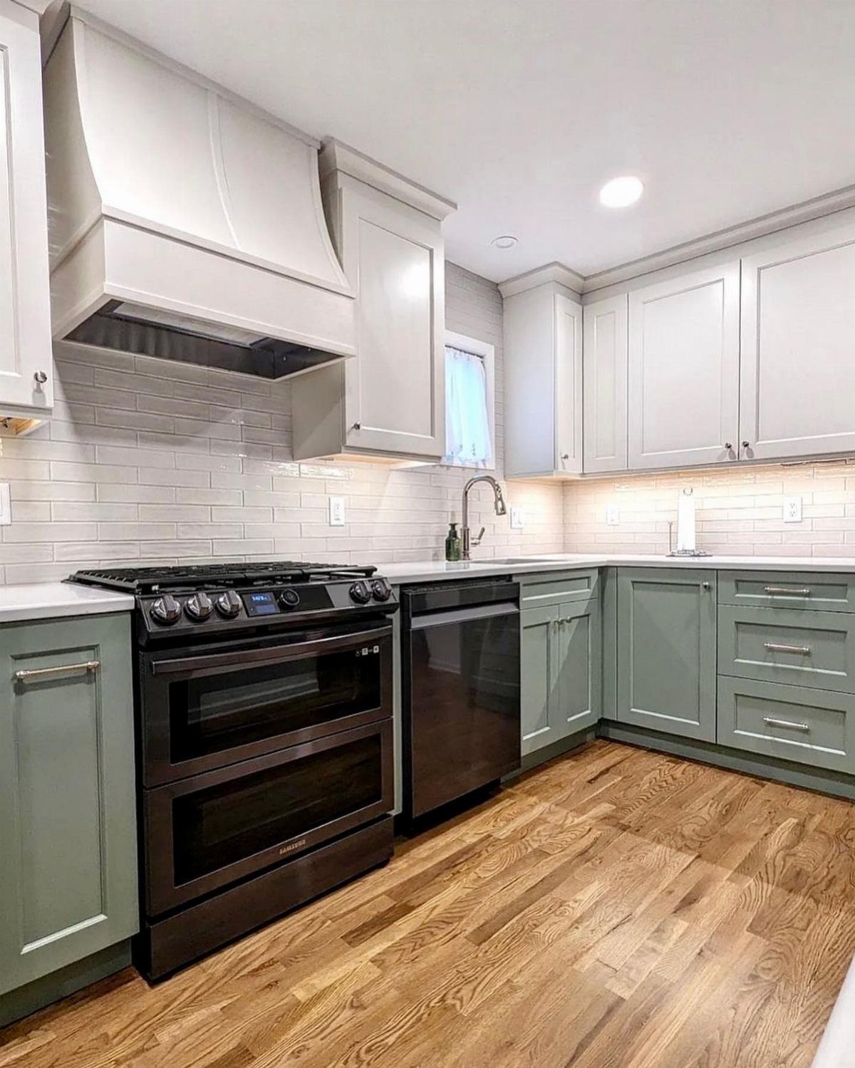 26 Sage Green Kitchen Ideas Using Wood, Brass, and Marble 6 Two-tone kitchen with sage green lower cabinets and white upper cabinets.