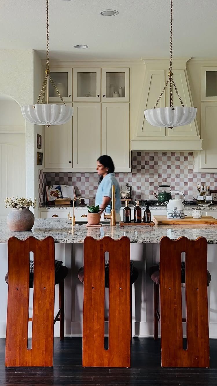 Vintage Kitchen Lighting Fixtures: 12 Pendant and Sconce Ideas 11 Two white scalloped glass pendant lights hanging over a granite kitchen island.